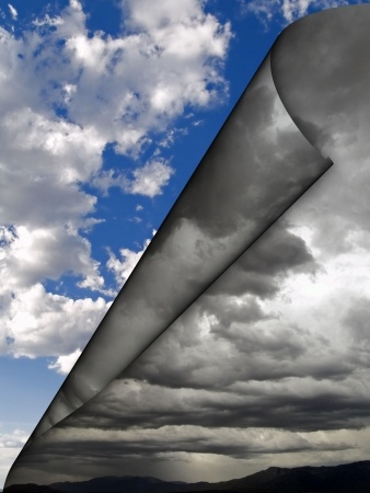 An image depicting the sky partially rolled back like a page in a book. The foreground reveals dark, stormy clouds, while the background shows a blue sky with fluffy, white clouds. This contrast symbolizes a change between stormy weather and clear skies, evoking Colin Powell’s vision of resilience and hope.