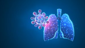 Digital illustration of stylized human lungs composed of blue geometric lines and shapes, with a multi-colored virus-like particle, resembling the novel coronavirus, approaching from the left side on a dark blue background, evoking the presence of COVID-19.