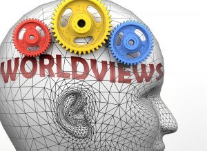 A wireframe model of a human head with yellow, red, and blue gears inside it features the word "WORLDVIEWS" in bold, red text intersecting the side of the head.